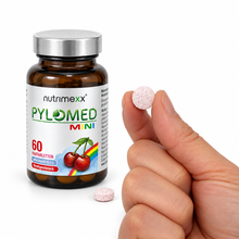Load image into Gallery viewer, Nutrimexx Pylomed Mini – Kautablette in der Hand – Größenvergleich